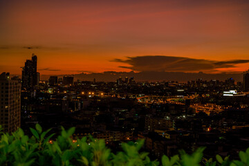 panoramic high-angle evening background of the city view,with natural beauty and blurred sunsets in the evening and the wind blowing all the time,showing the distribution of city center accommodation