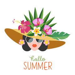 Hello summer. A beautiful girl in a hat decorated with exotic flowers and fruits. - 439273972