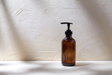 beauty, cosmetics and object concept - bottle of shower gel or liquid soap with dispenser