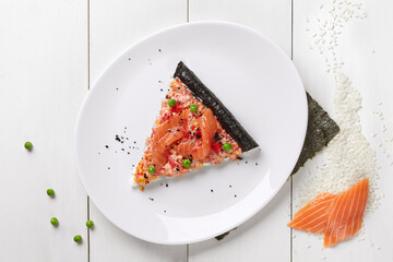 Slice of sushi pizza with fresh salmon and tobiko