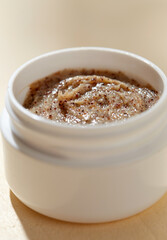 beauty, cosmetics and object concept - close up of natural body scrub in jar
