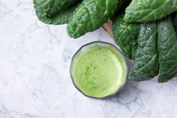 Fresh organic green kale leaves pattern on a white background, flat lay healthy nutrition concept,Tasty kale smoothie - obrazy, fototapety, plakaty