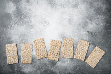 Buckwheat crisp bread, on gray stone table background, top view flat lay, with copy space for text