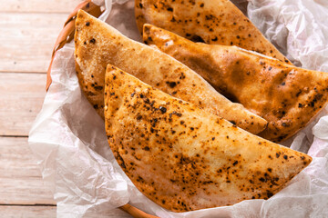 Traditional Chilean empanadas on wooden table