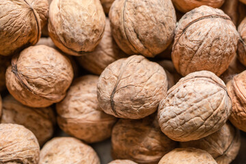 Walnuts in their shells, top view close-up
