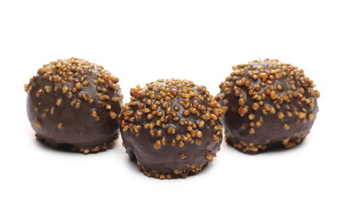 Chocolate truffles with caramel filling and peanut flavor isolated on white background