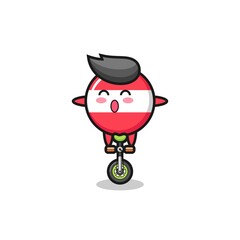 The cute austria flag badge character is riding a circus bike