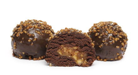 Chocolate truffles with caramel filling and peanut flavor isolated on white background