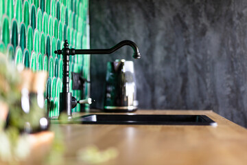 Kitchen home staging, black faucet close-up