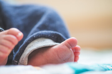 Baby and newborn concept: Close up of newborn baby feet on baby blanket