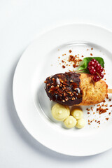 Chicken Kiev, with mashed potatoes and berries, top view, light background, close-up, serving of Kiev cutlet from the chef.