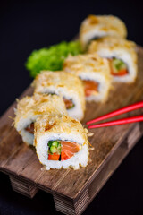 Katsuobushi Uramaki Sushi Roll with salmon and cucumber