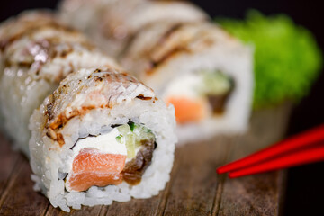 Uramaki Sushi Roll with salmon fish, avocado and cream cheese philadelphia