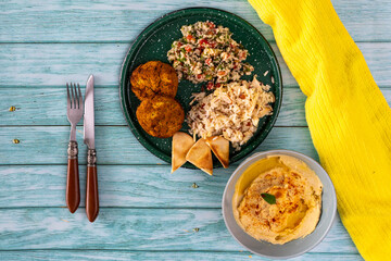typical dish of Mediterranean cuisine in a wooden background