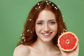 Beautiful happy half naked topless redhead hair woman 20s with nude make up hold grapefruit...