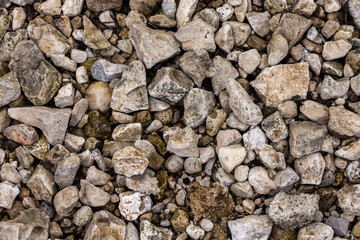 The texture of stones with jagged edges. Lots of small stones.