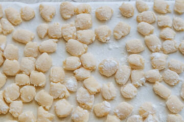 Fototapeta na wymiar dough close-up on a plastic board sprinkled with flour