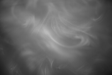 Abstract black and white background of white smoke
