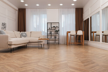 Modern living room with parquet flooring and stylish furniture - obrazy, fototapety, plakaty