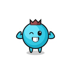 the muscular blueberry character is posing showing his muscles
