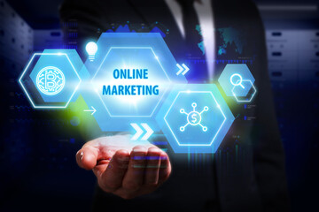 Business, Technology, Internet and network concept. Young businessman working on a virtual screen of the future and sees the inscription: Online marketing