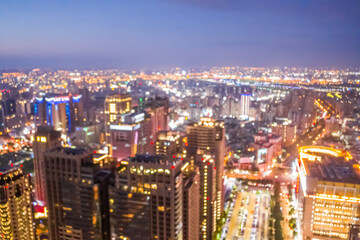 Fototapeta na wymiar background of city skyline at night in aerial view