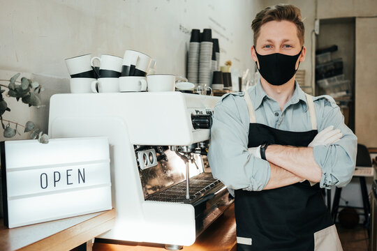 Portait Of Local Coffee House Owner Smiling And Using Safety Gloves And Mask