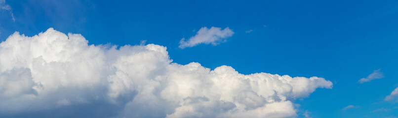 Naklejka na ściany i meble Big white cloud in the blue sky, panorama