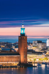 Fototapeta premium Stockholm, Sweden. Famous Tower Of Stockholm City Hall. Popular Destination Scenic In Sunset Twilight Dusk Lights. Evening Lighting.