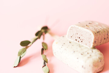 Popsicle in white chocolate cutaway on pink background
