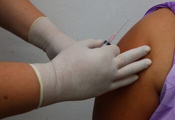 Doctor inject vaccine to patient.Selective focus Vaccines against COVID-19 or Corona Virus