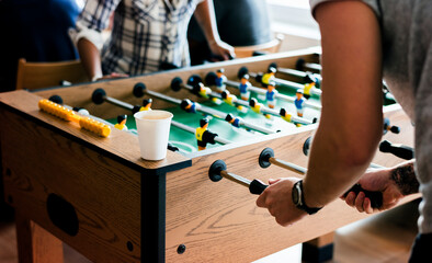 People playing table football - obrazy, fototapety, plakaty
