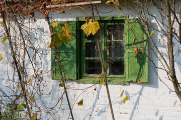 old farmhouse with green window