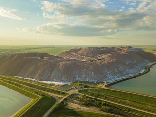 Drone view of the industrial landscape in the salt mountains, Soligorsk landfills at sunset, Belarus