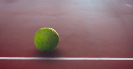 Composition of tennis ball with copy space on tennis court