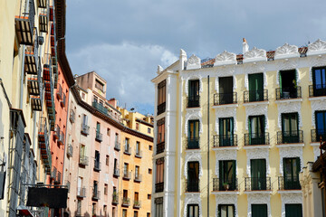 Fototapeta na wymiar Classy renaissance aged buildings on the other side of Plaza Mayor under vivid sky downtown Madrid, Spain