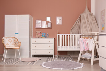 Baby room interior with stylish furniture and comfortable crib © New Africa