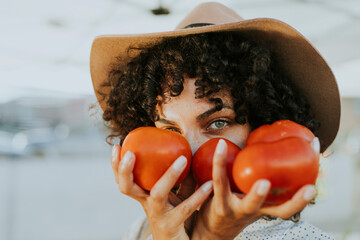 Woman buying tomatoes at a farmers market