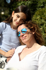 mother and daughter relaxed outdoors in the sun