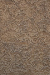 texture of brown plastered wall with whirls and swirls