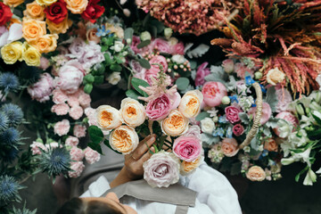 Woman picking up some Romantic Vuvuzela Roses