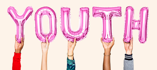 Hands holding balloons spelling Youth