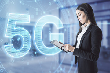 Attractive businesswoman in blurry office using smartphone with 5G network digital hologram and internet of things background. High speed internet concept. Double exposure.
