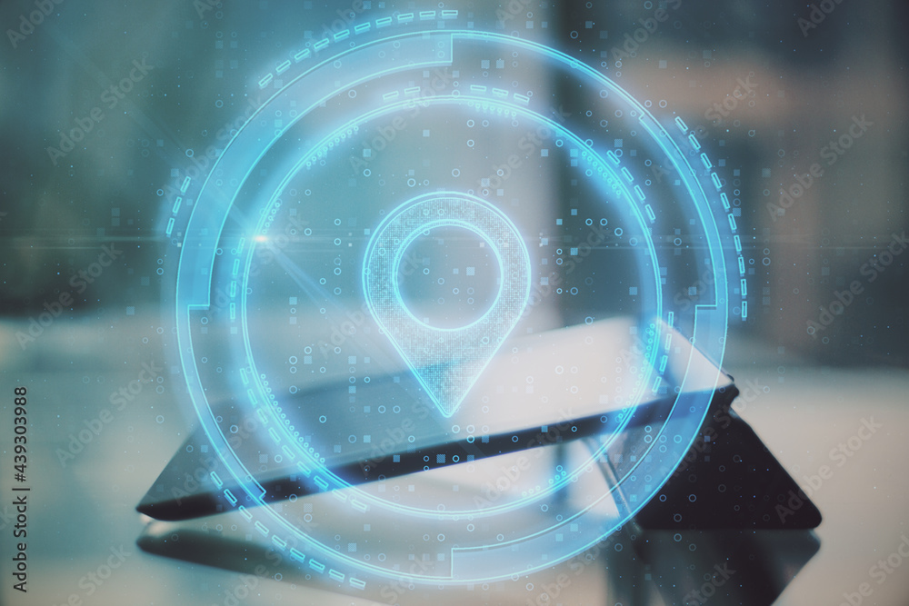 Poster close up of tablet on desktop with glowing digital map pin on blue background. futuristic navigation