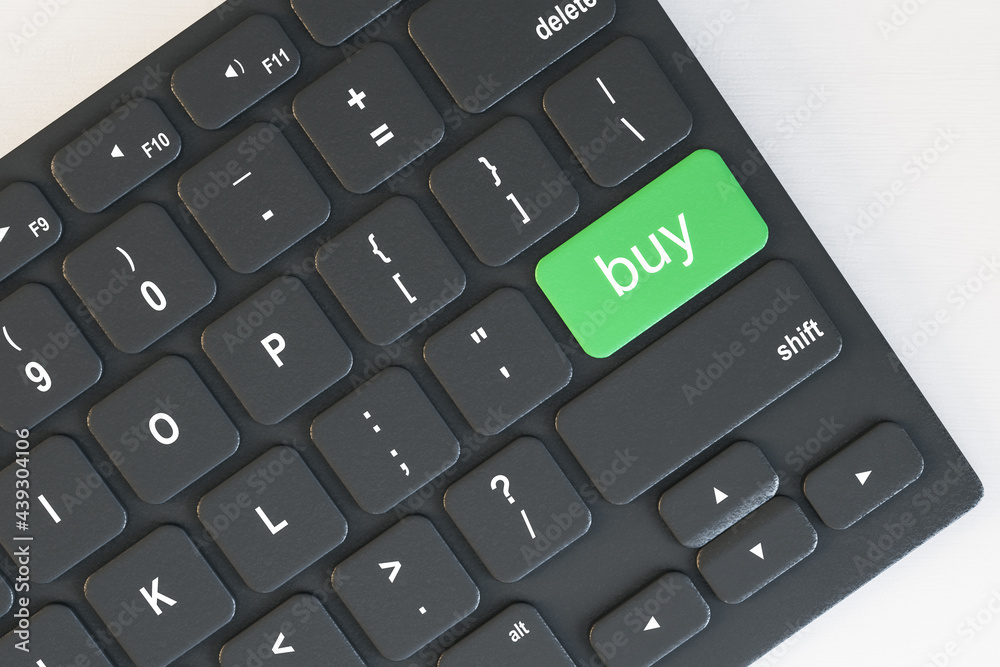 Poster Top view and close up of computer keyboard with green buy button on desktop. Online purchase and shopping concept. 3D Rendering.