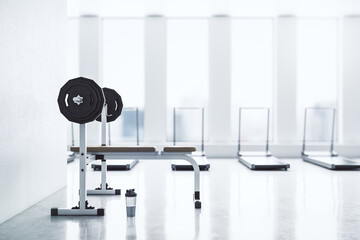 Modern gym interior with empty mockup space, equipment and daylight. Mock up, 3D Rendering.