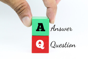 green and red wooden cubes with the letters Q and A or Question and Answer
