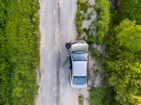 Man Repairs Car On Country Road At Summer Day, Aerial Photo