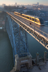 Fototapeta premium The Porto Metro tram on the Ponte Luis I on a winter morning