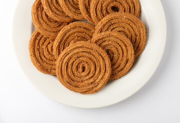 Indian Traditional Tea Time Snack Chakli, a deep fried snack, It is known as Chakali, Murukku, Muruku, Murkoo, Chakri.
